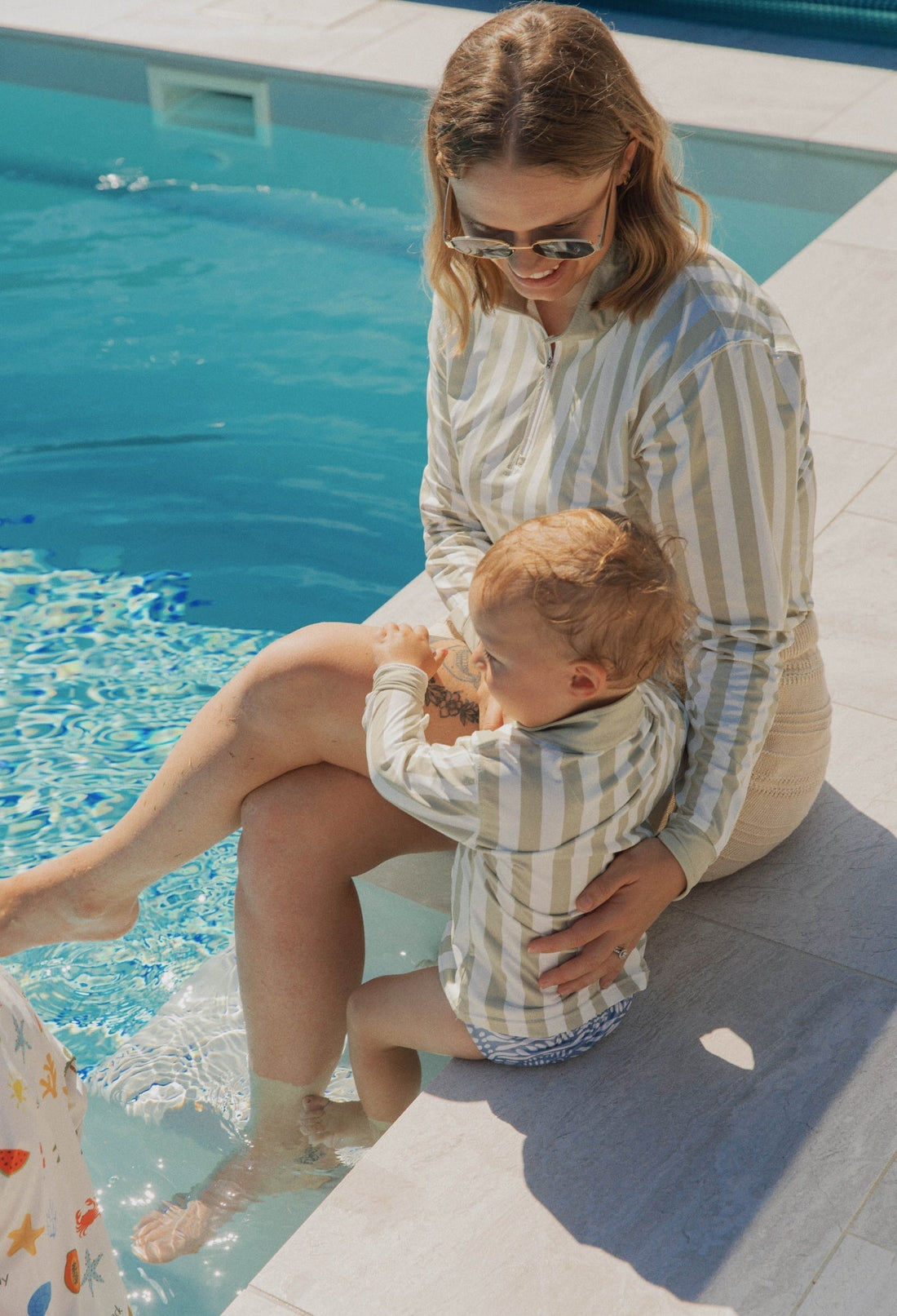 mother and children wearing UPF sun shirts outdoors