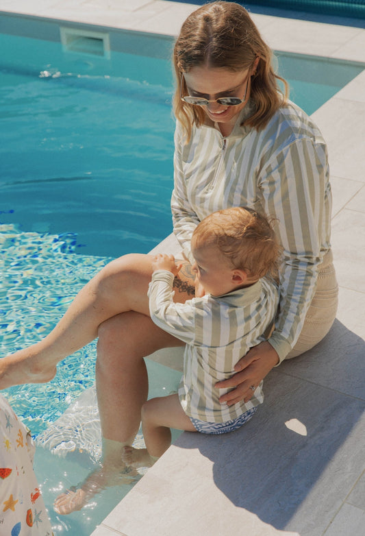 mother and children wearing UPF sun shirts outdoors