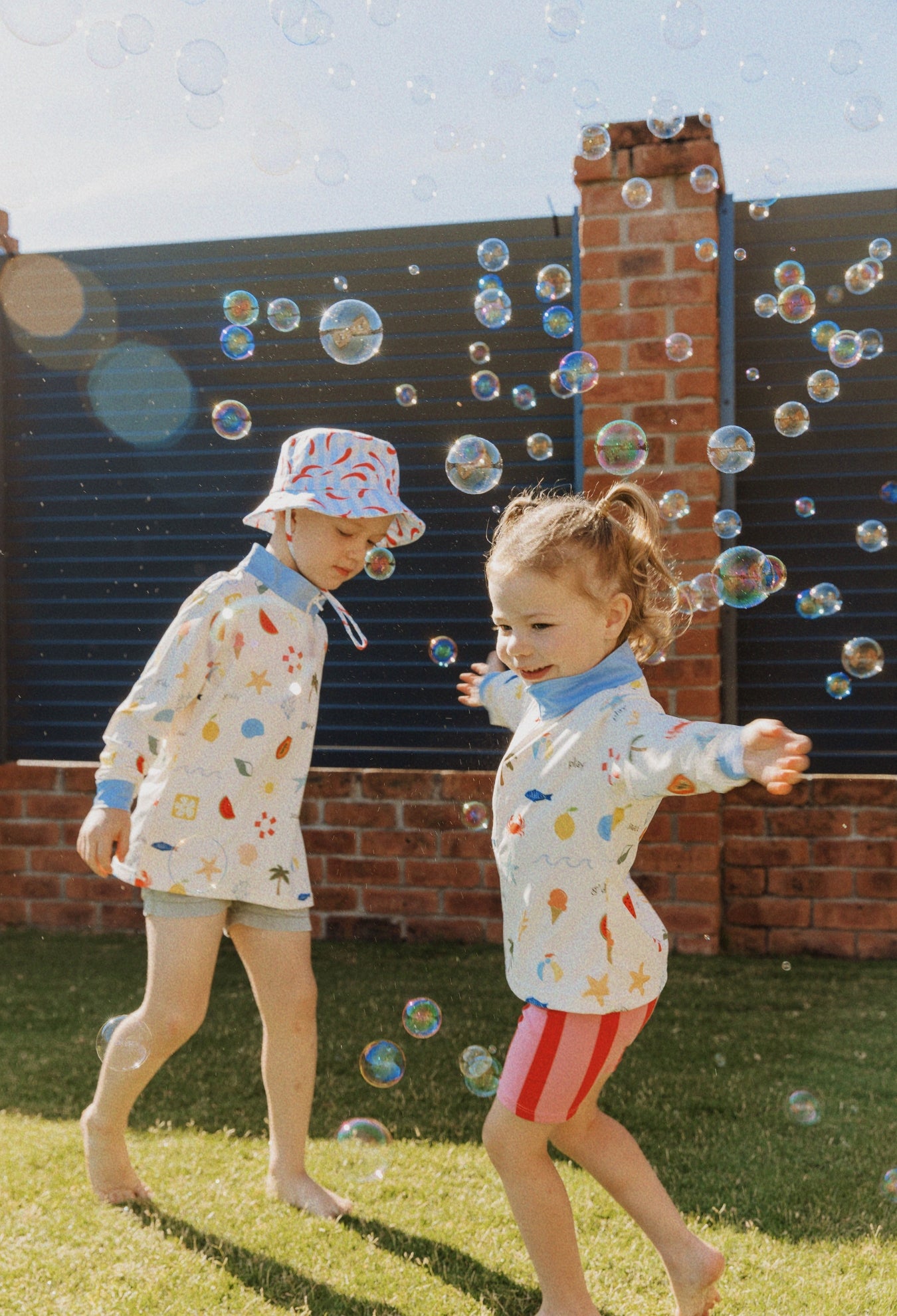 Child wearing Golden Days kids UPF 50+ sunwear shirt outdoors