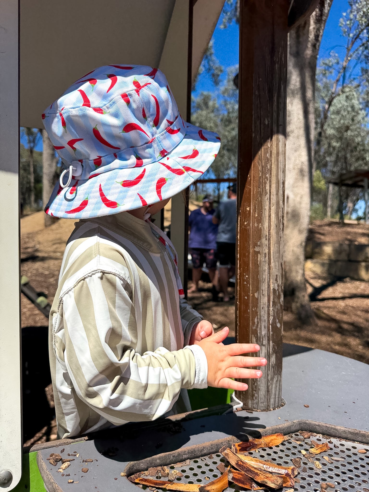 Child wearing Sol & Tide UPF 50+ kids sun shirt outdoors