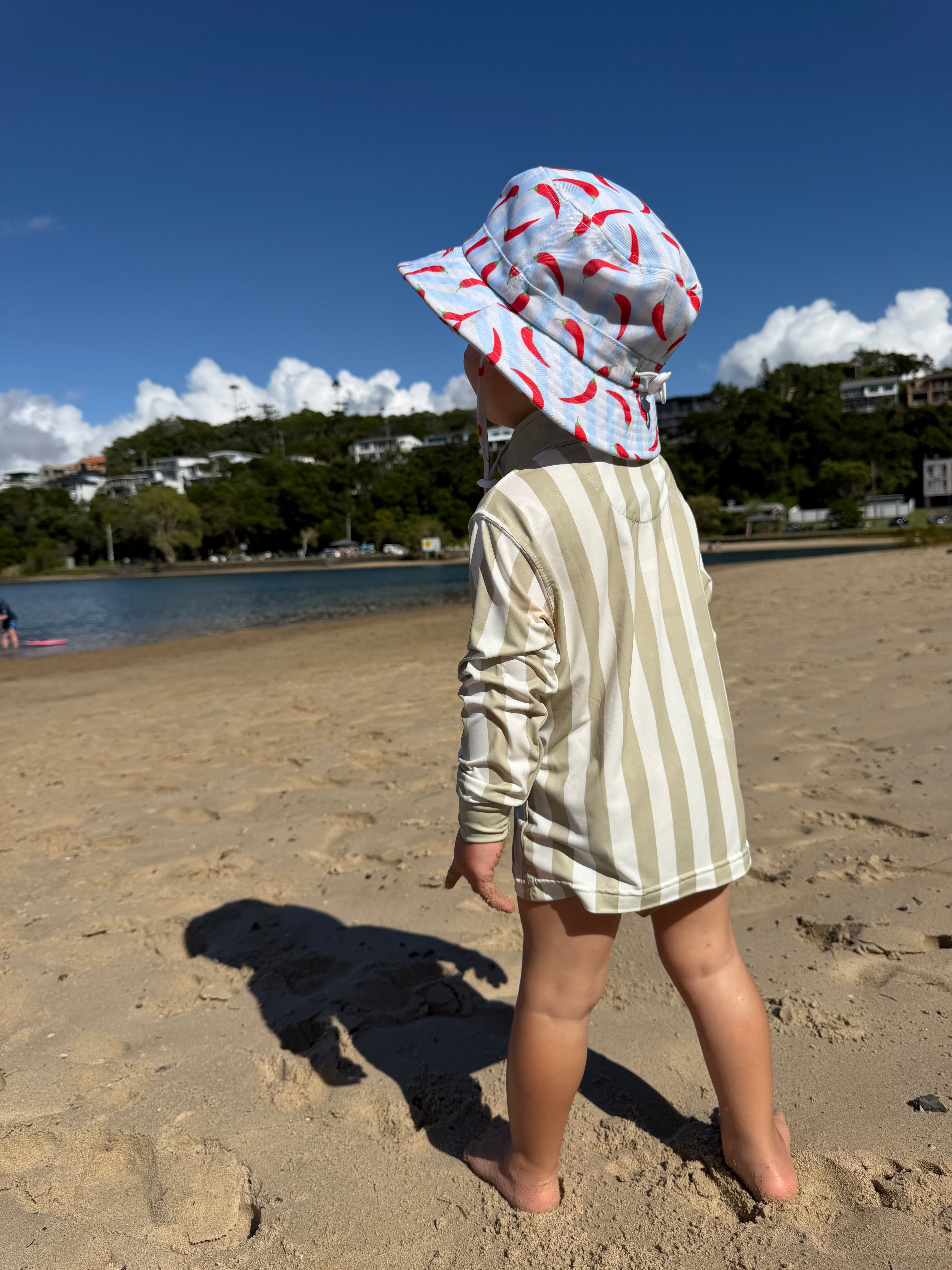 Child wearing Sol & Tide UPF 50+ kids sun shirt outdoors
